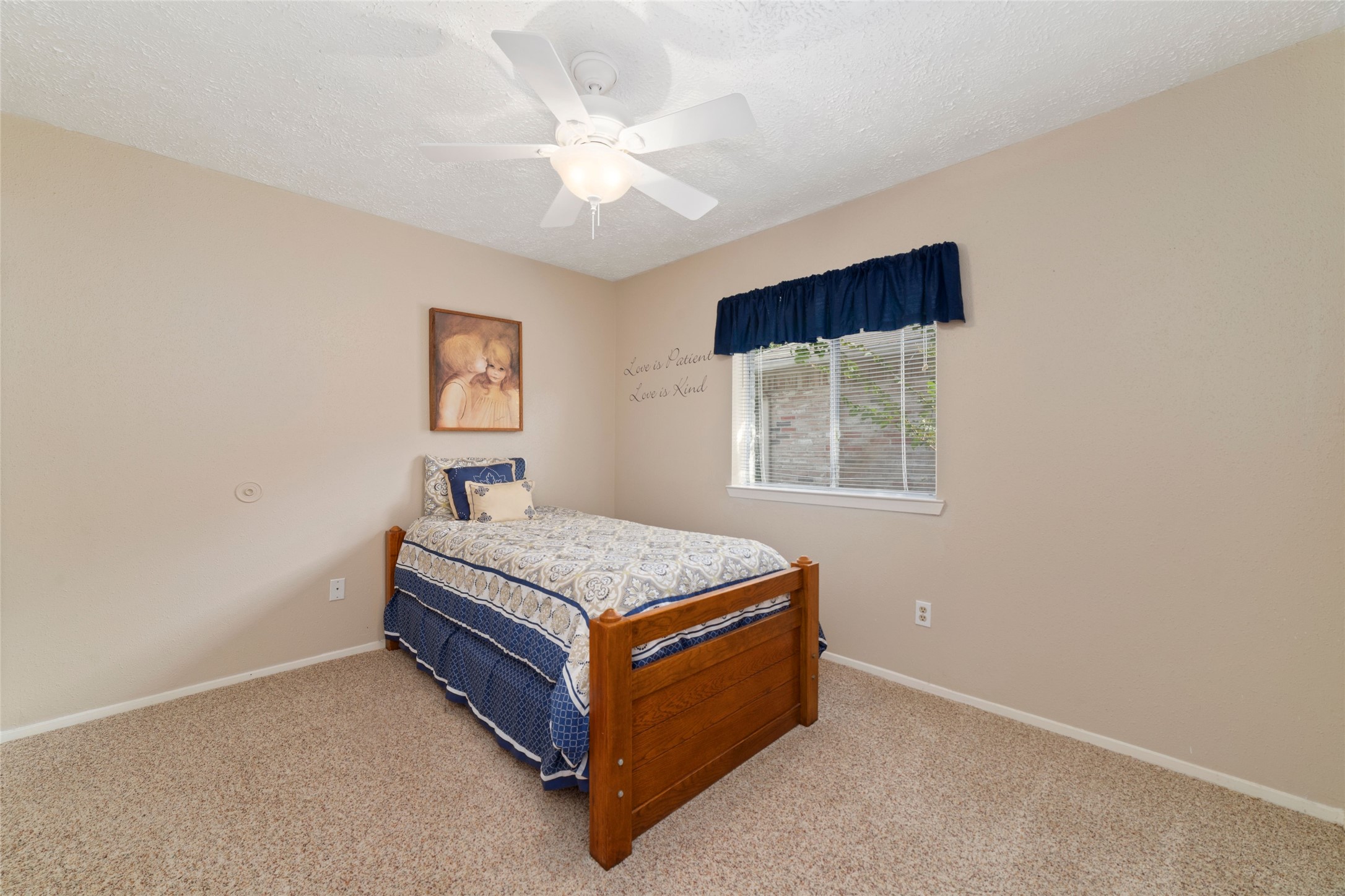 4711 Lost Lake Lane Spring, TX 77388 - Photo 17 of 26 a bedroom with a bed and a window