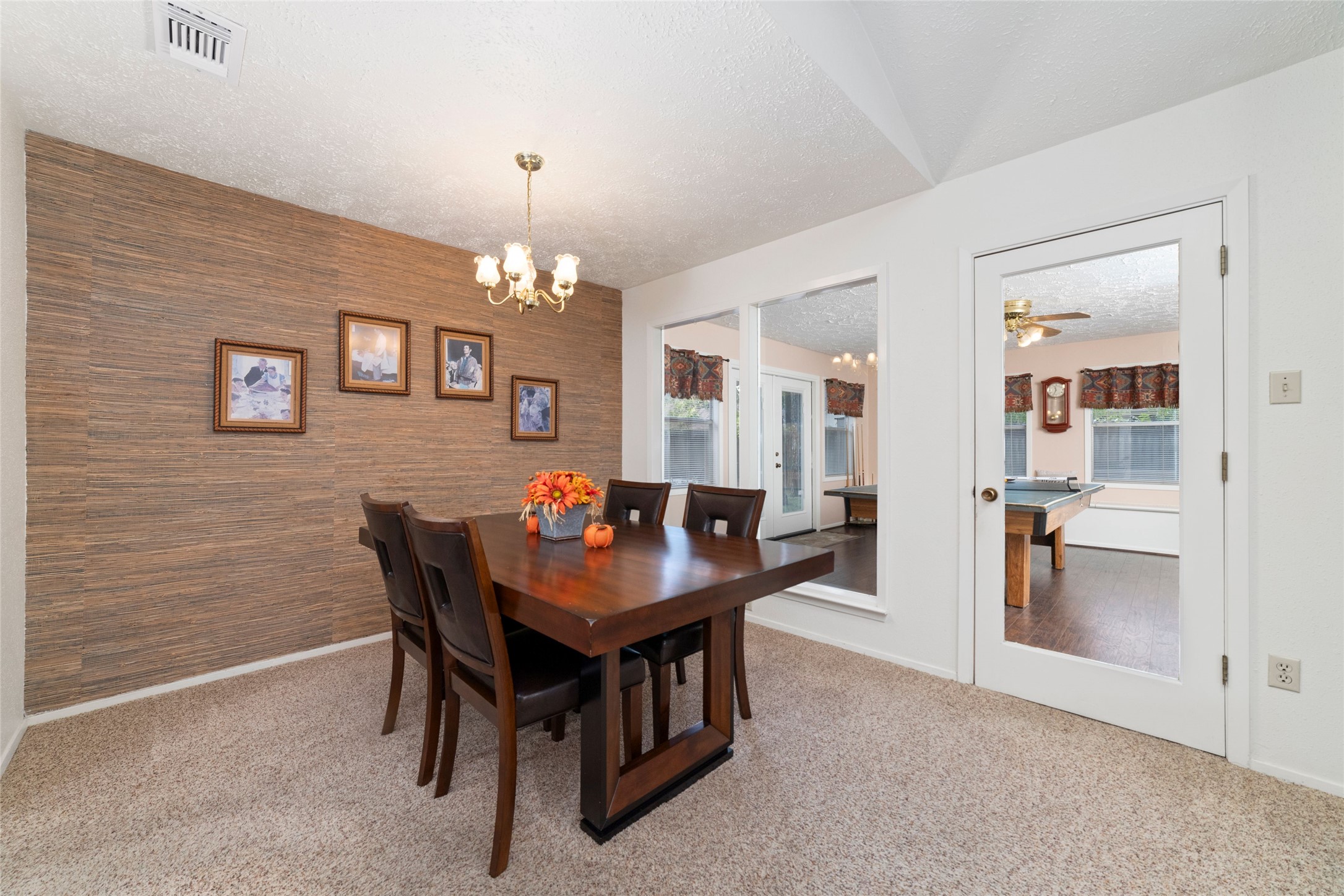 4711 Lost Lake Lane Spring, TX 77388 - Photo 21 of 26 a view of a dining room with furniture and chandelier