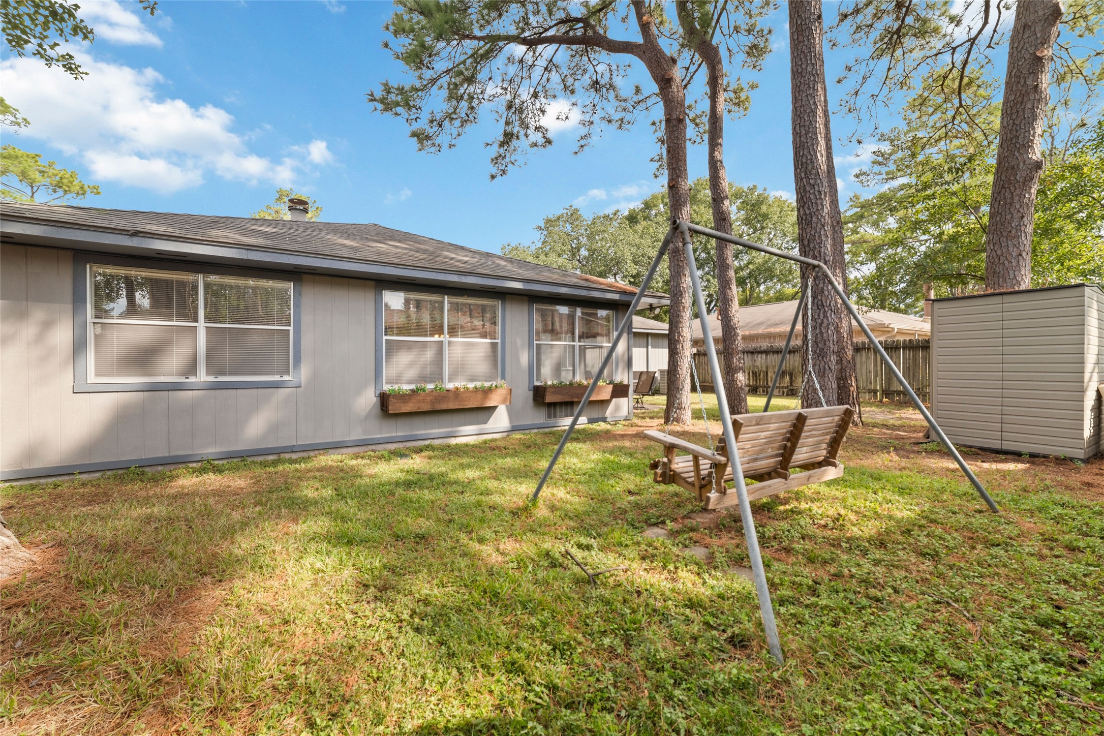4711 Lost Lake Lane Spring, TX 77388 - Photo 26 of 26 a backyard of a house with table and chairs
