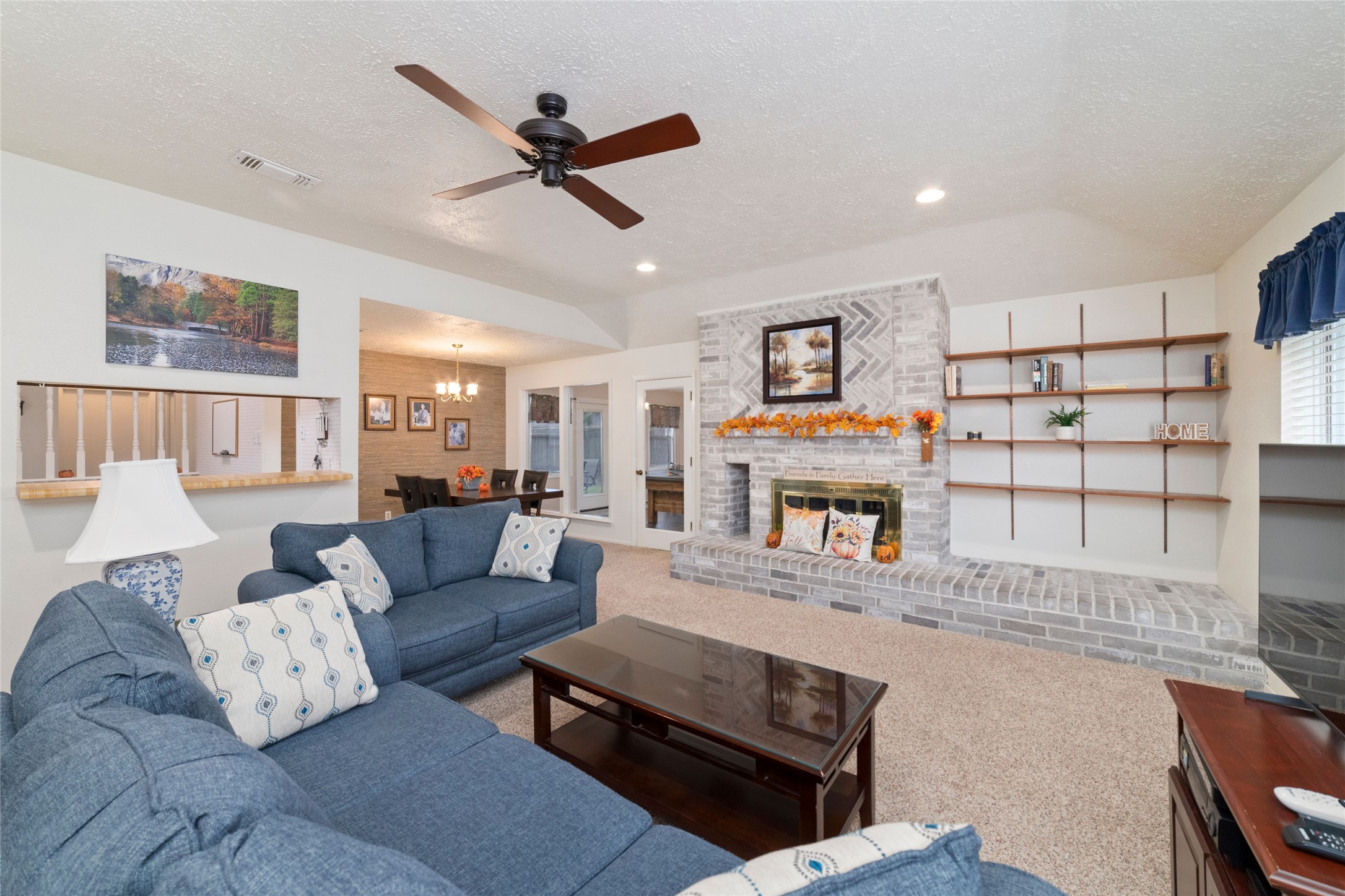 4711 Lost Lake Lane Spring, TX 77388 - Photo 6 of 26 a living room with furniture and a fireplace