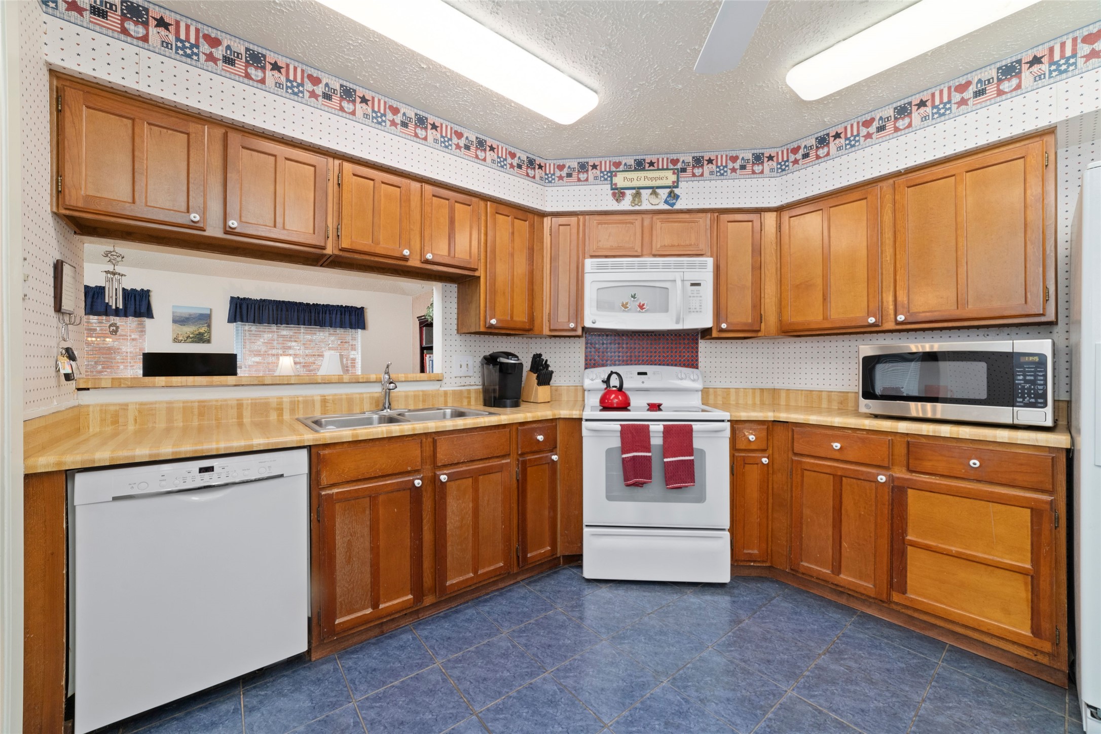 4711 Lost Lake Lane Spring, TX 77388 - Photo 9 of 26 a kitchen with stainless steel appliances granite countertop a sink and cabinets