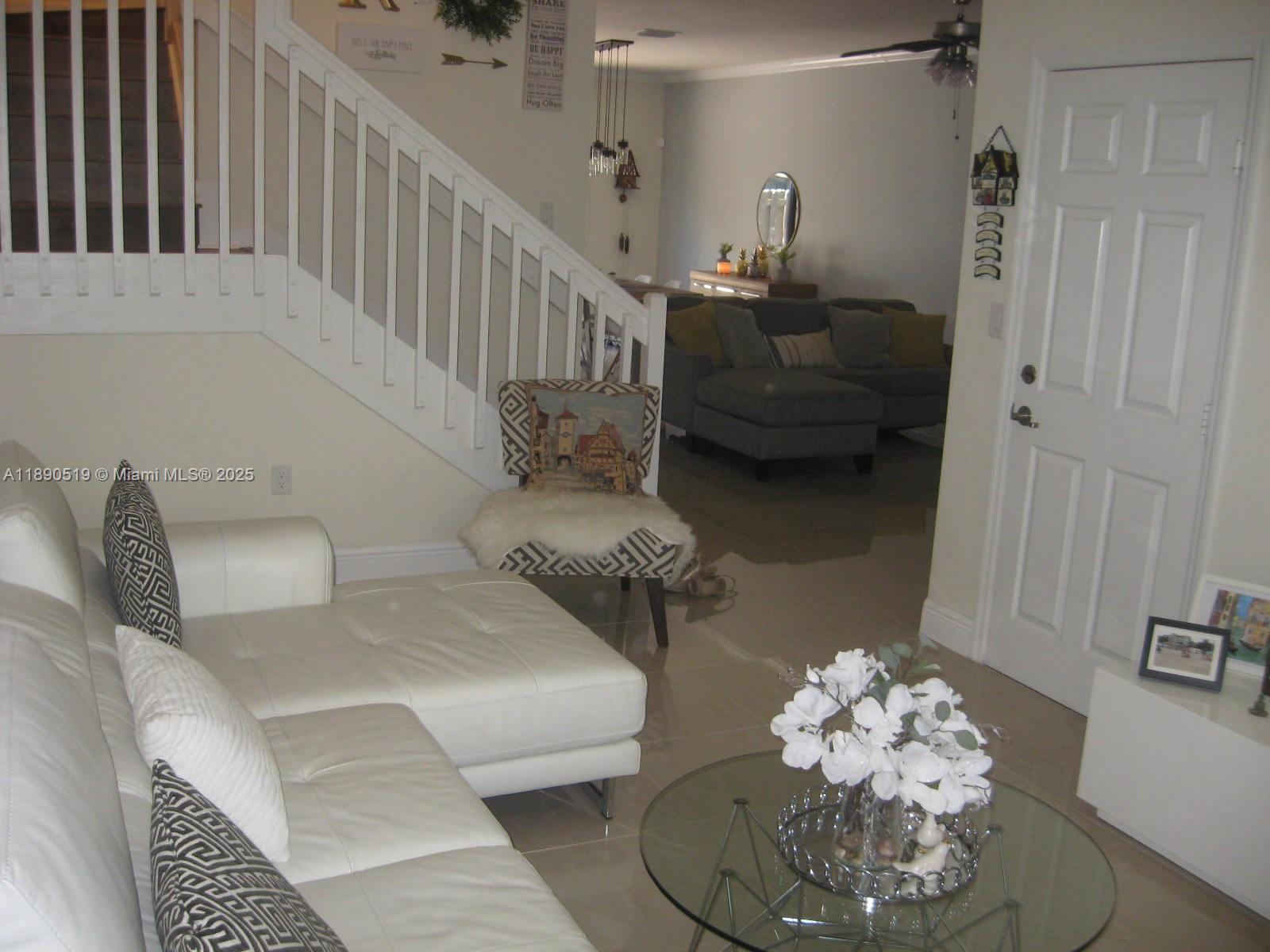 15070 Southwest 117th Way Miami, FL 33196 - Photo 13 of 14 a living room with furniture