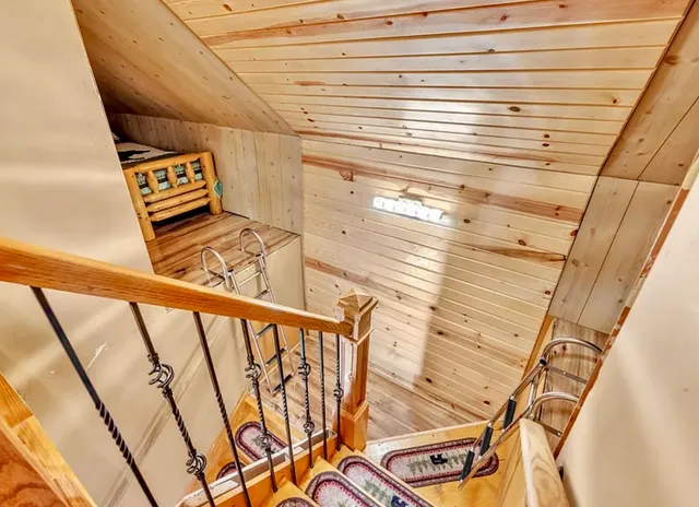 a dining room with furniture a fireplace and wooden floor