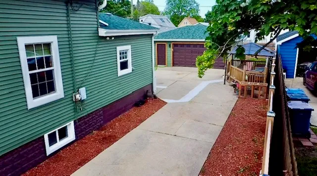a patio with table and chairs