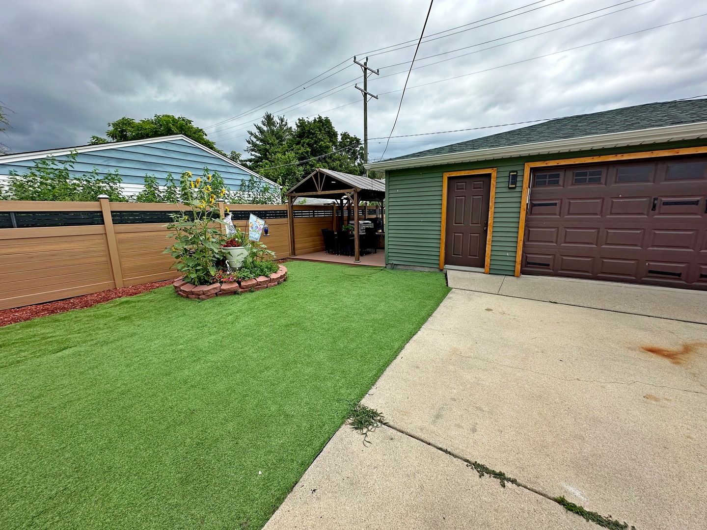 3515 Union Avenue Steger, IL 60475 - Photo 40 of 65 a front view of a house with a yard and potted plants