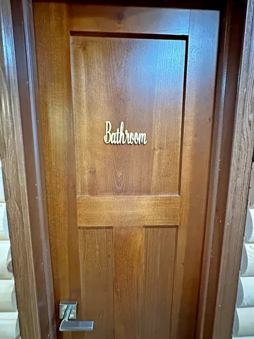 a view of backyard with deck and seating space