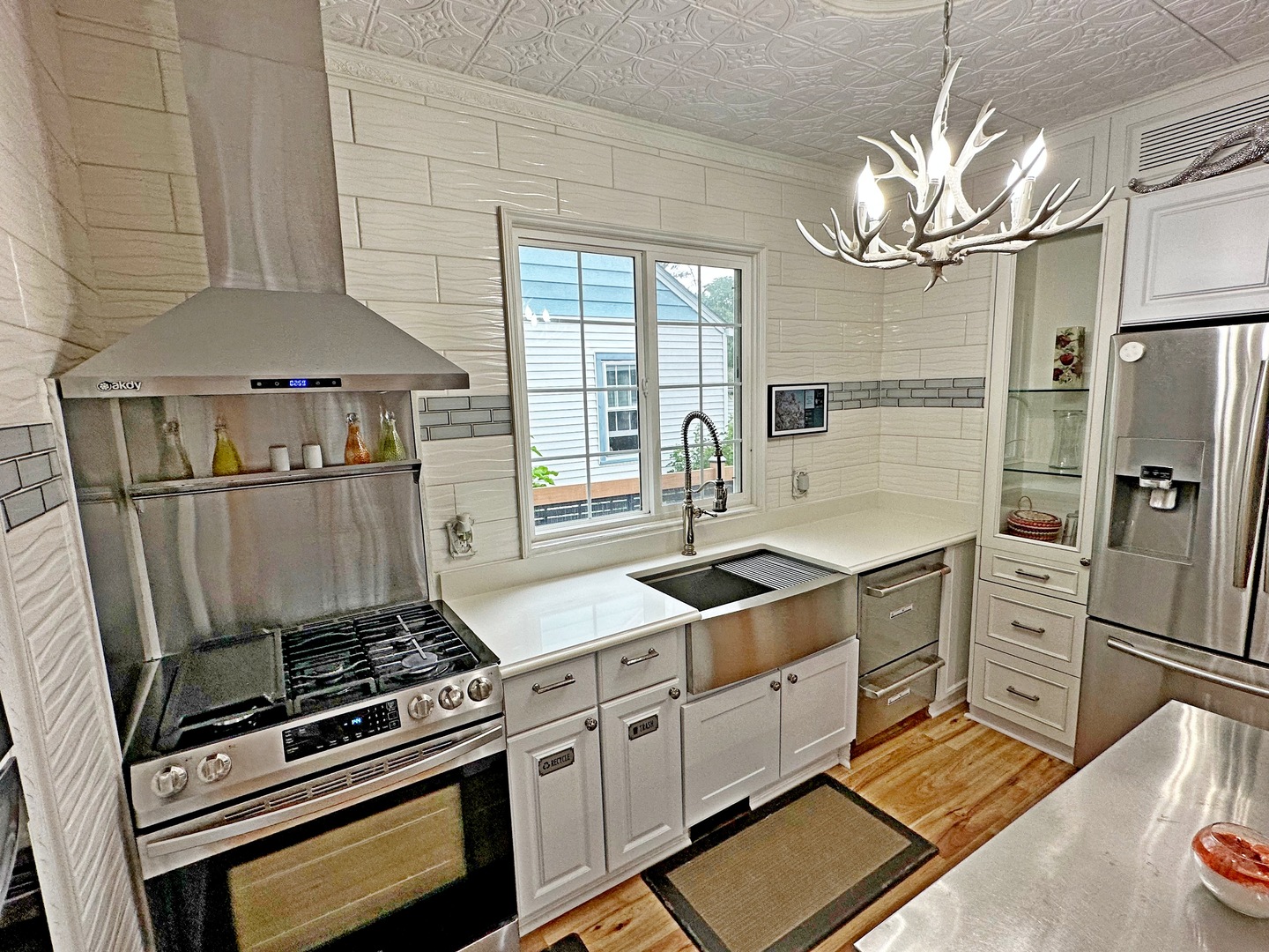 3515 Union Avenue Steger, IL 60475 - Photo 9 of 65 a kitchen with stainless steel appliances a stove a refrigerator and cabinets