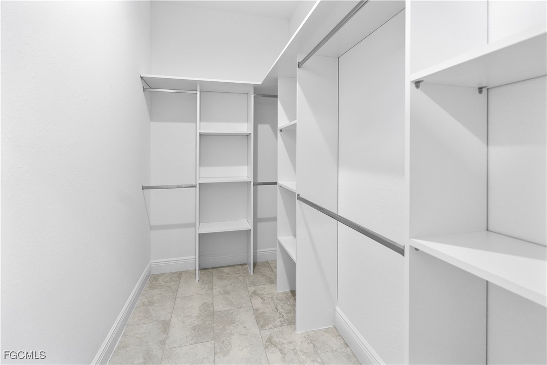 5008 Myrtlewood Road LaBelle, FL 33935 - Photo 18 of 37 a view of walk in closet with empty racks