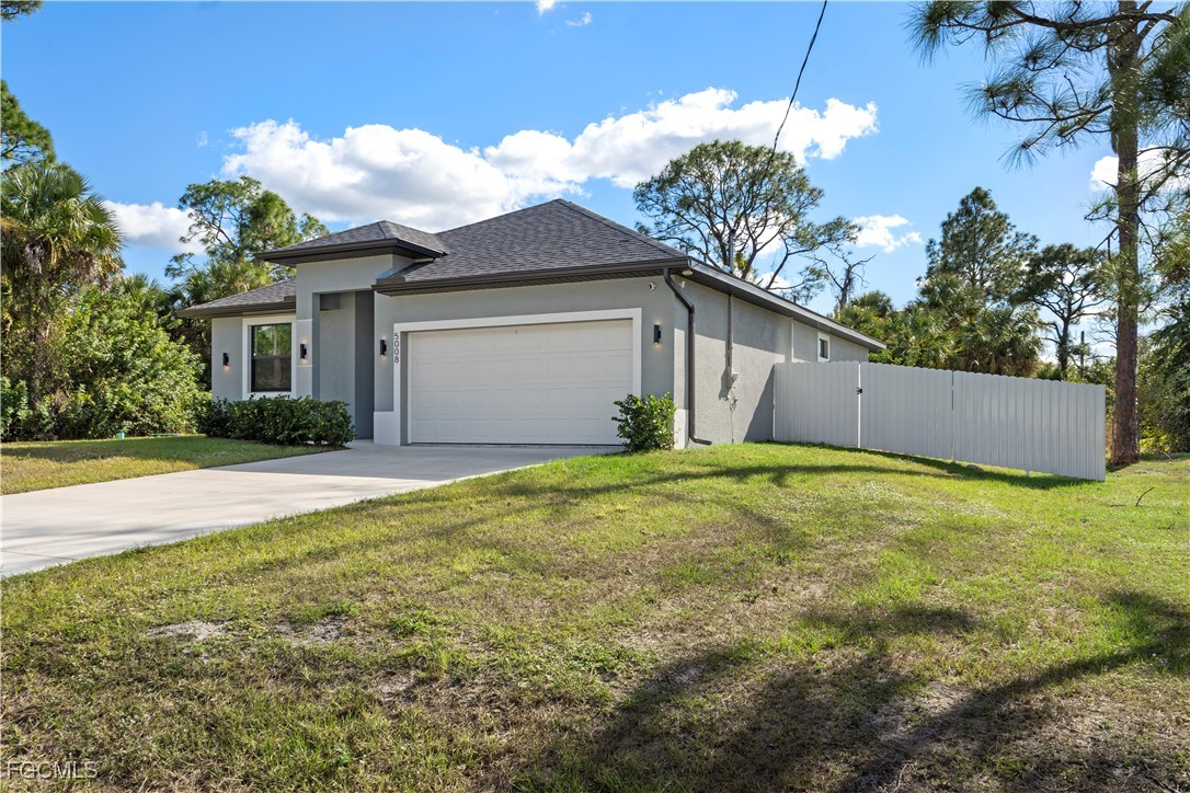 5008 Myrtlewood Road LaBelle, FL 33935 - Photo 2 of 37 a view of a house with a yard and potted plants