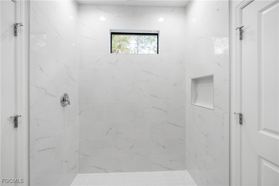 5008 Myrtlewood Road LaBelle, FL 33935 - Photo 24 of 37 a bathroom with a shower