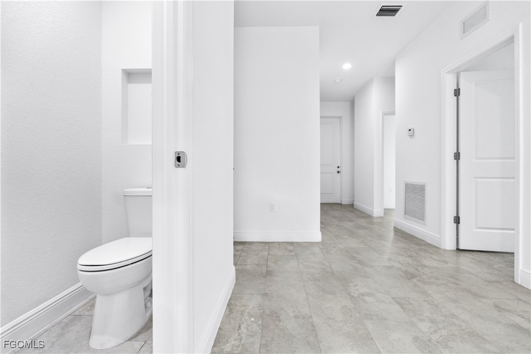 5008 Myrtlewood Road LaBelle, FL 33935 - Photo 32 of 37 a view of a bathroom with a toilet and a shower