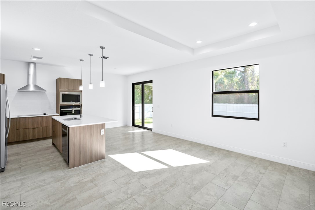5008 Myrtlewood Road LaBelle, FL 33935 - Photo 6 of 37 a view of kitchen with sink microwave and cabinets