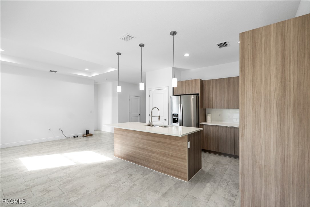 5008 Myrtlewood Road LaBelle, FL 33935 - Photo 9 of 37 a large white kitchen with a large window