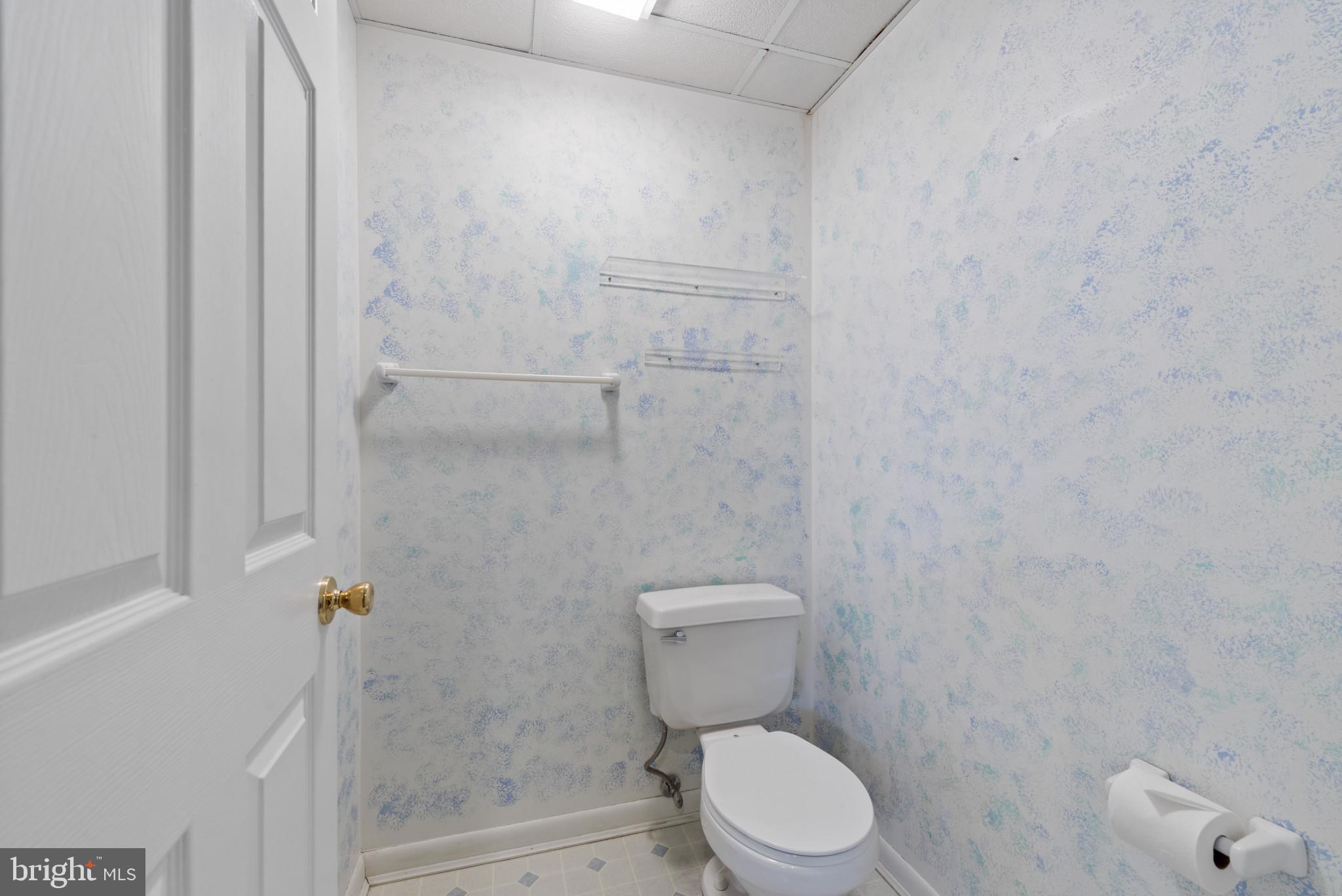 452 Doe Meadow Drive Owings Mills, MD 21117 - Photo 26 of 34 a white toilet sitting next to a shower