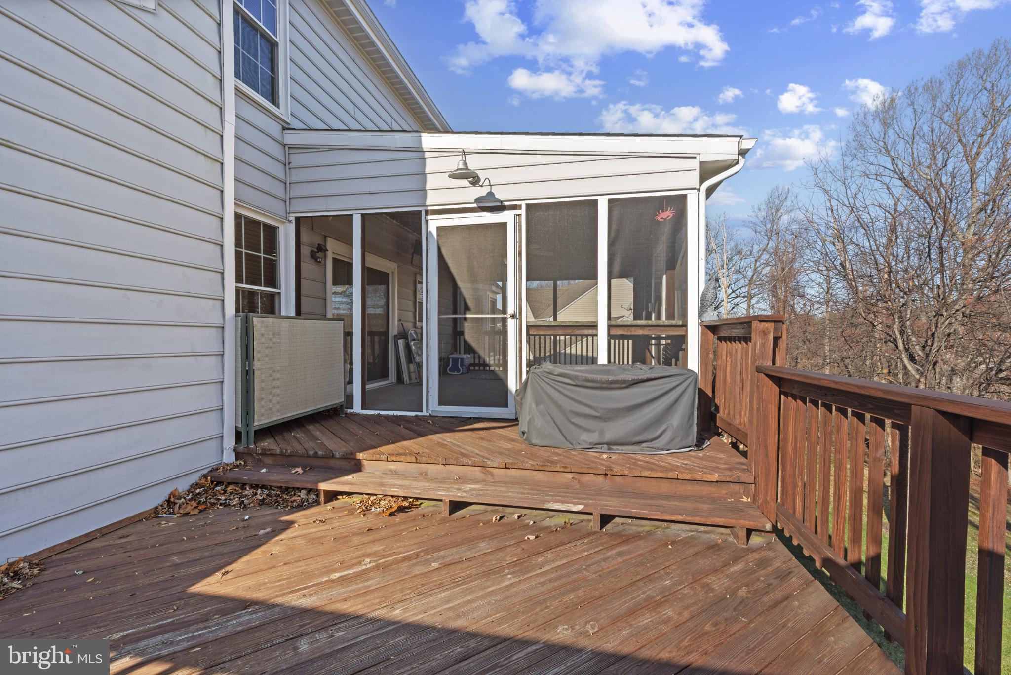 452 Doe Meadow Drive Owings Mills, MD 21117 - Photo 29 of 34 a view of a house with a wooden floor and a yard