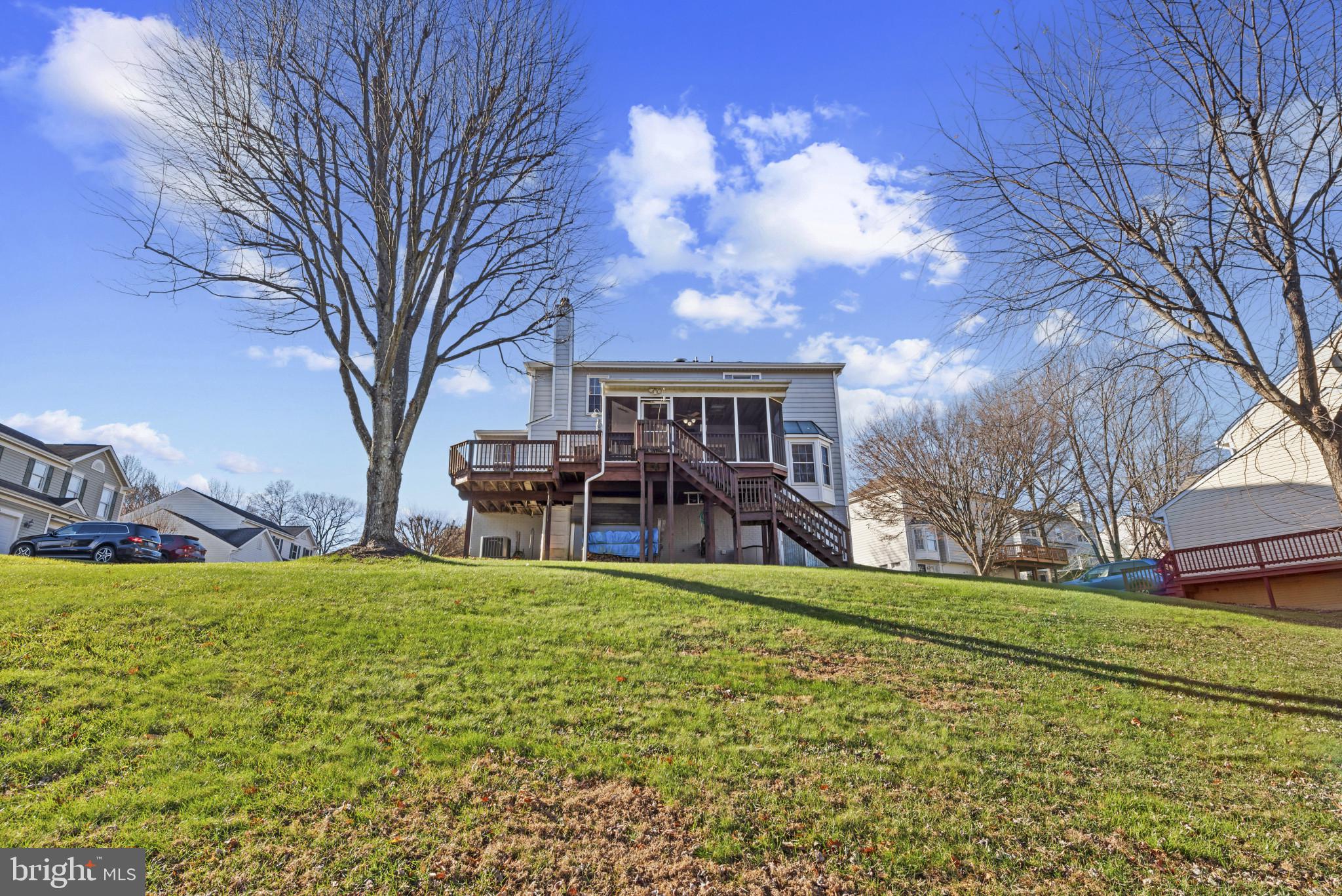 452 Doe Meadow Drive Owings Mills, MD 21117 - Photo 30 of 34 a view of a house with a yard