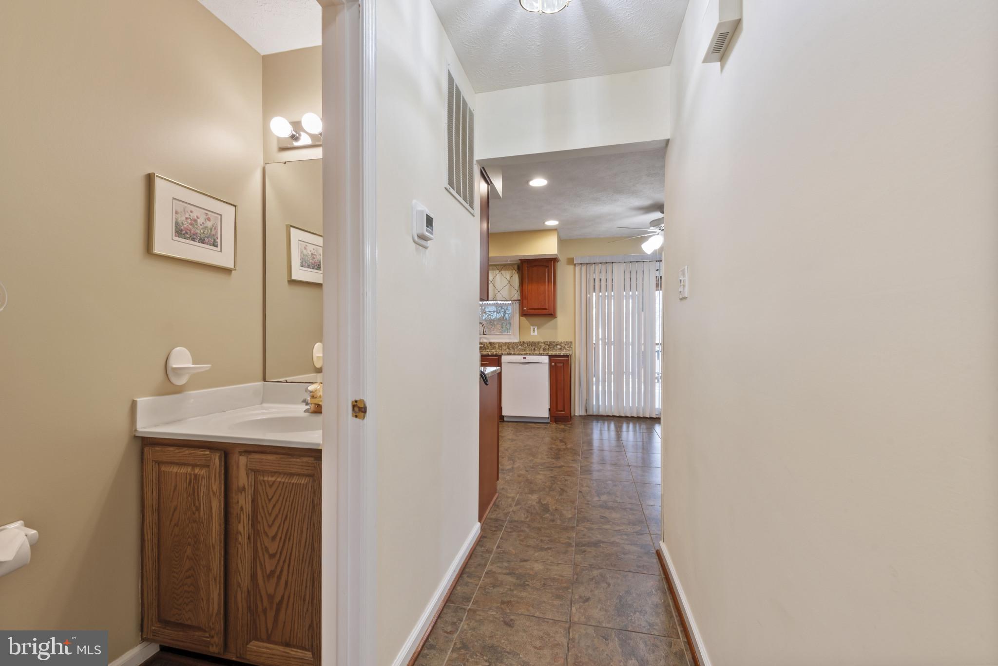 452 Doe Meadow Drive Owings Mills, MD 21117 - Photo 9 of 34 a bathroom with a sink and mirror
