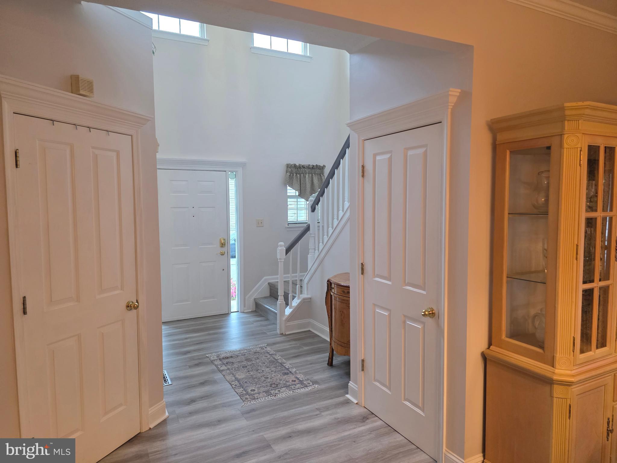2441 Kemper Road Crofton, MD 21114 - Photo 2 of 63 a view of entryway with wooden floor and stairs