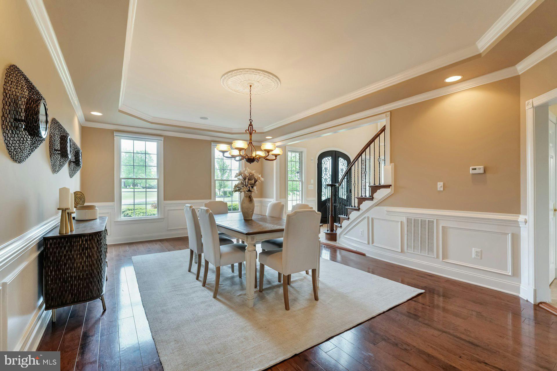 18102 Eaglesham Court Leesburg, VA 20175 - Photo 18 of 92 a view of a dining room with furniture window and wooden floor