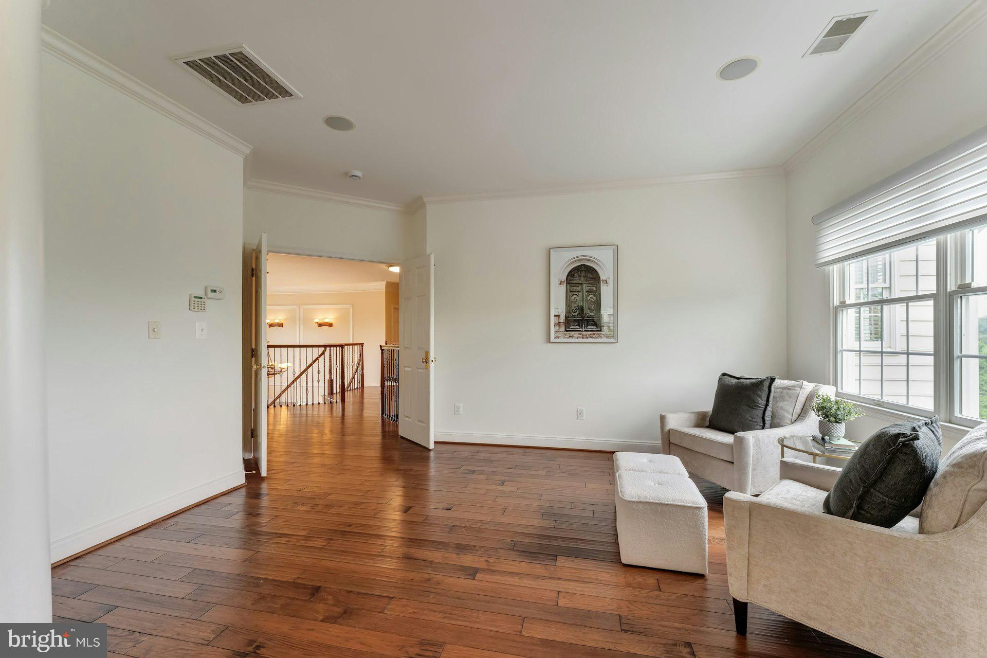 18102 Eaglesham Court Leesburg, VA 20175 - Photo 35 of 92 a living room with furniture and a window