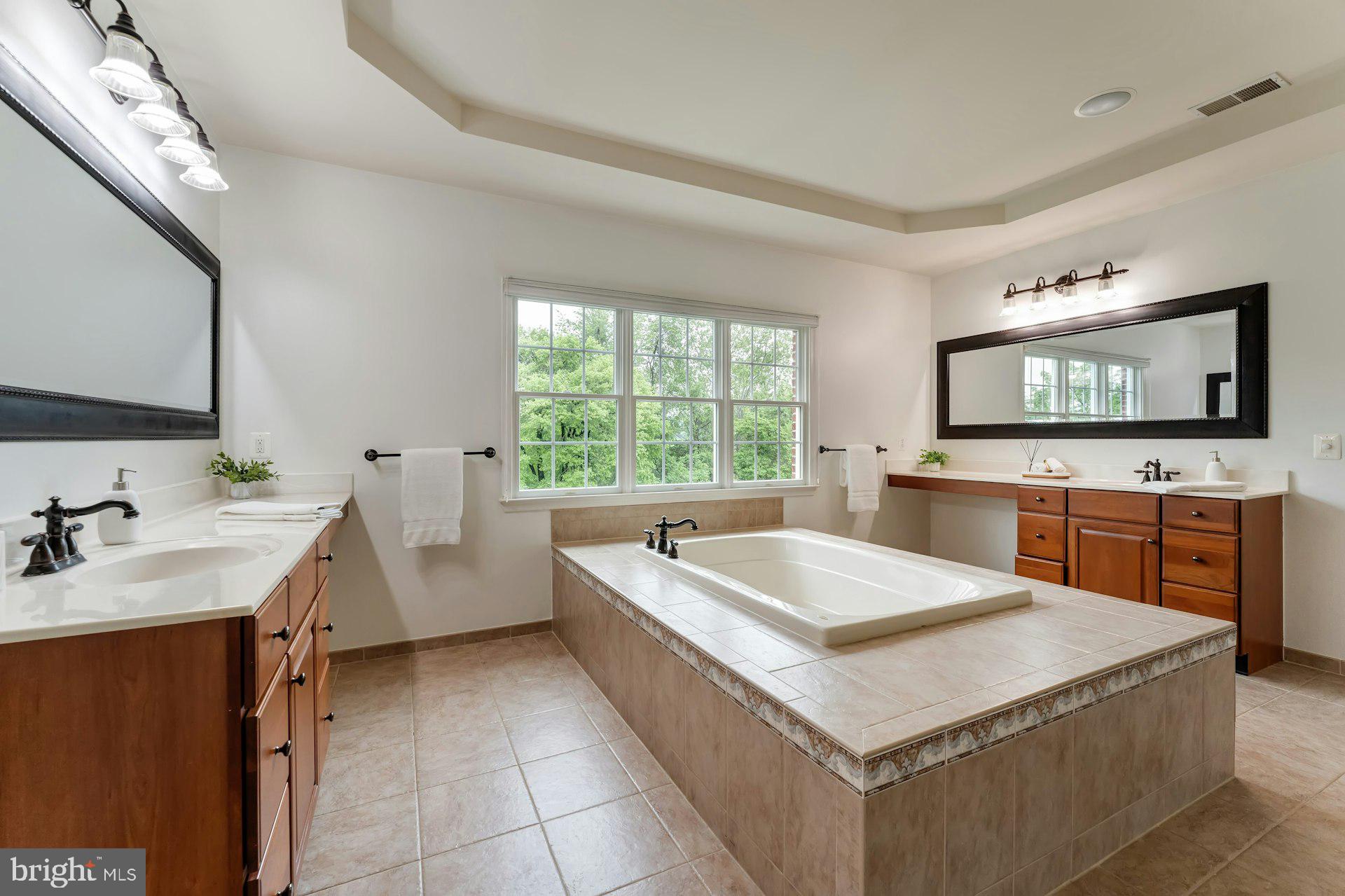 18102 Eaglesham Court Leesburg, VA 20175 - Photo 39 of 92 a living room with stainless steel appliances kitchen island granite countertop a sink and a stove top oven