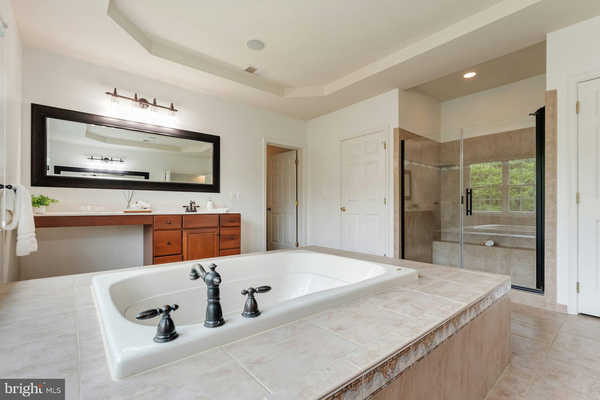 18102 Eaglesham Court Leesburg, VA 20175 - Photo 41 of 92 a kitchen with stainless steel appliances granite countertop a sink and a microwave