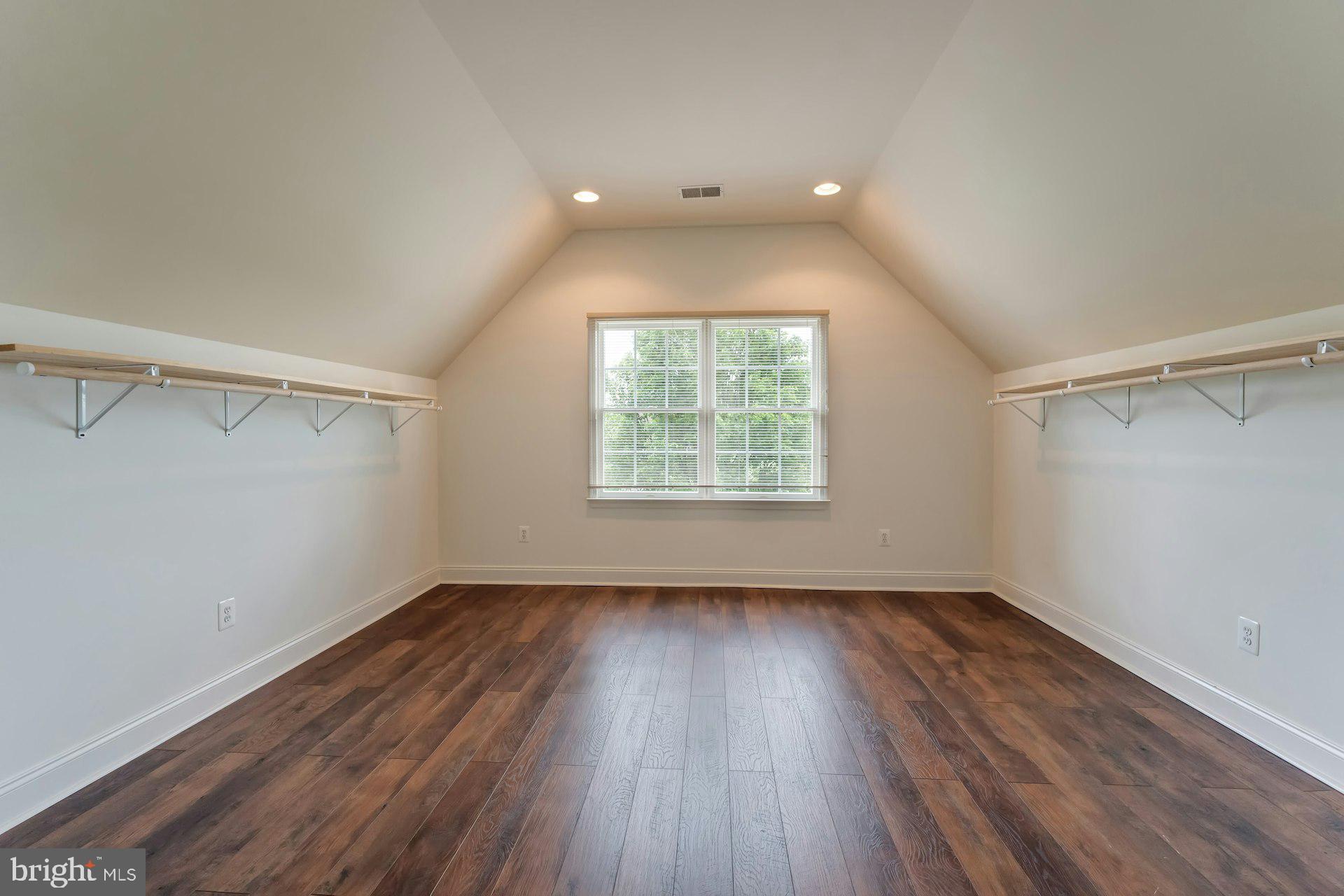 18102 Eaglesham Court Leesburg, VA 20175 - Photo 42 of 92 an empty room with wooden floor and windows