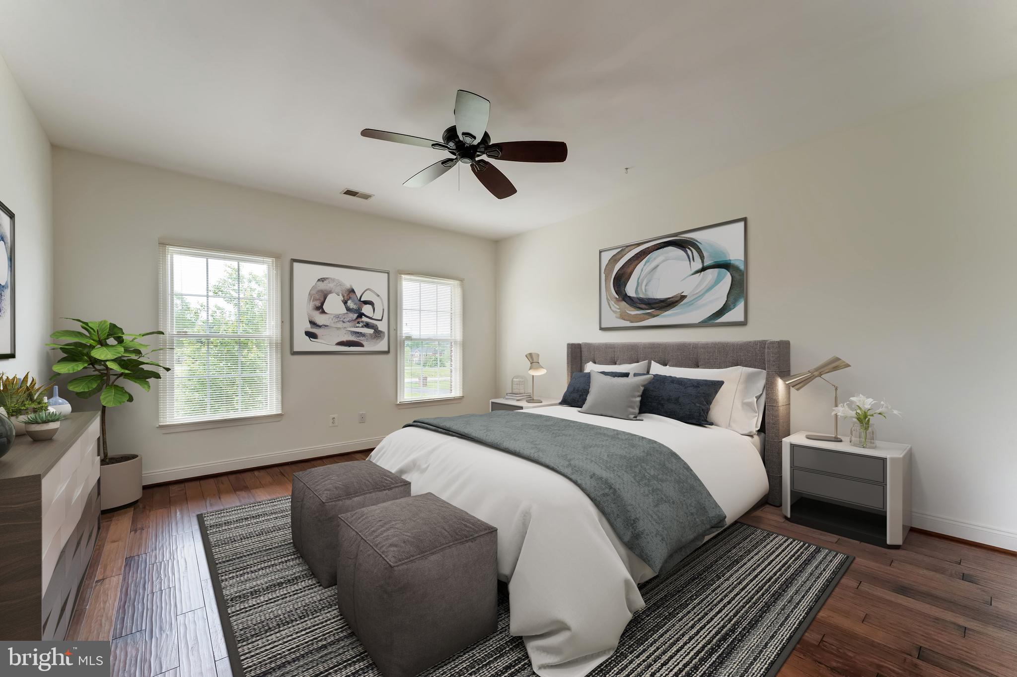 18102 Eaglesham Court Leesburg, VA 20175 - Photo 48 of 92 a bedroom with a bed and wooden floor