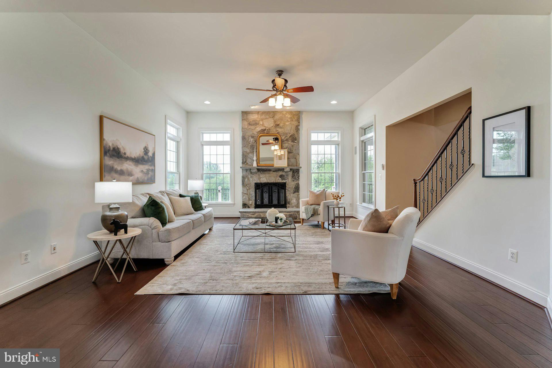 18102 Eaglesham Court Leesburg, VA 20175 - Photo 5 of 92 a living room with fireplace furniture and a wooden floor