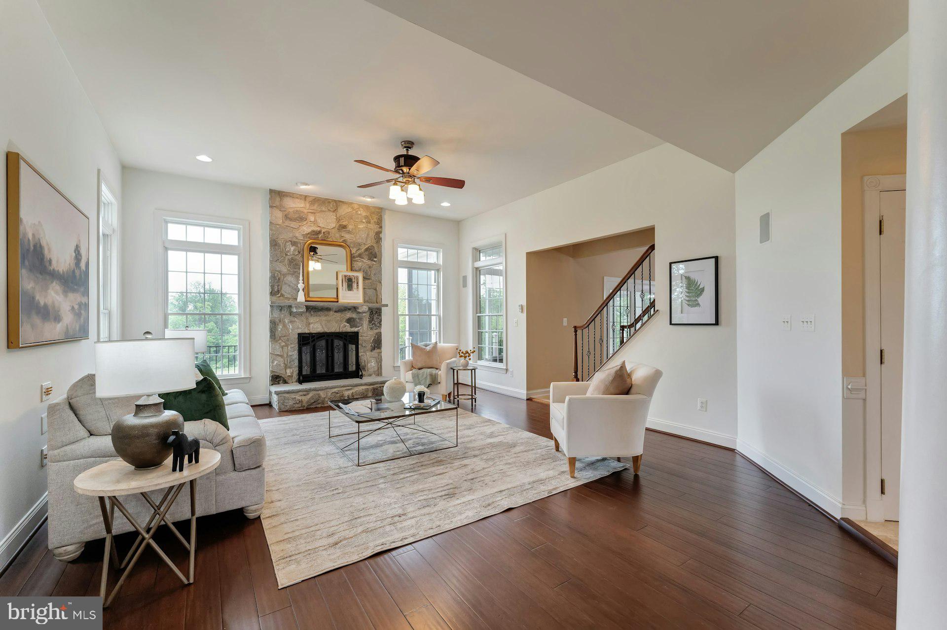 18102 Eaglesham Court Leesburg, VA 20175 - Photo 6 of 92 a living room with furniture and a fireplace