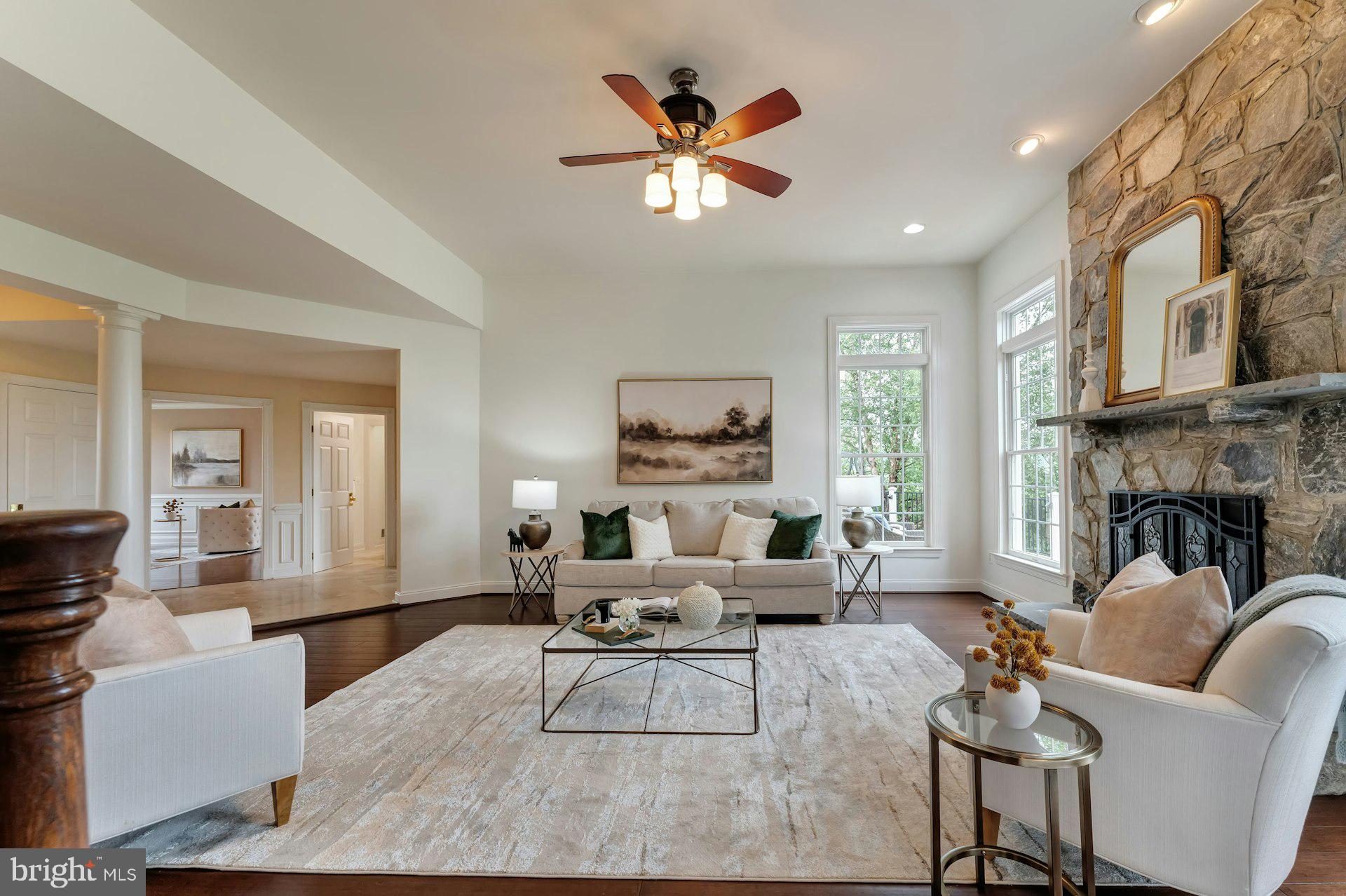 18102 Eaglesham Court Leesburg, VA 20175 - Photo 7 of 92 a living room with furniture and a fireplace