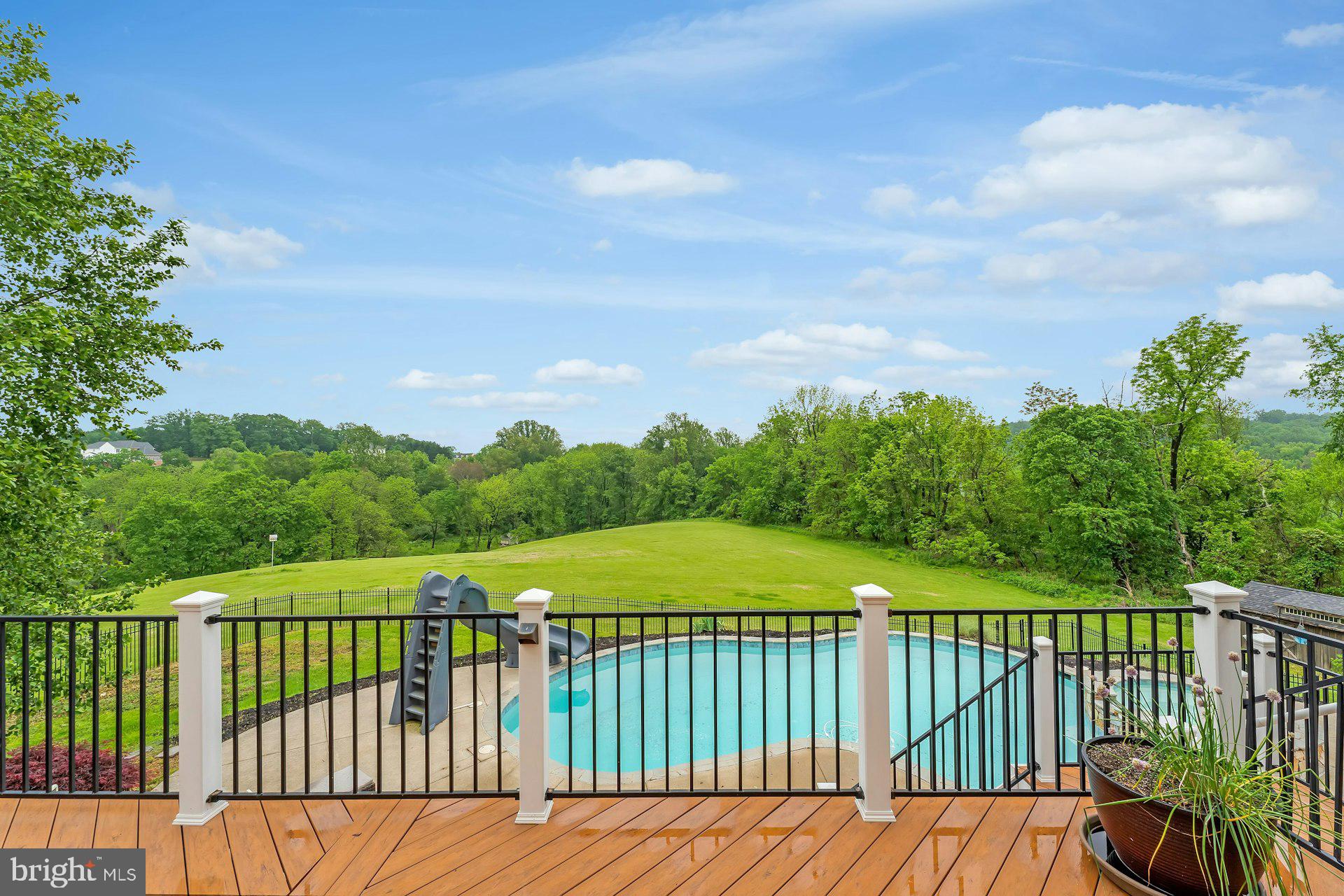 18102 Eaglesham Court Leesburg, VA 20175 - Photo 75 of 92 a view of a balcony with wooden floor & fence