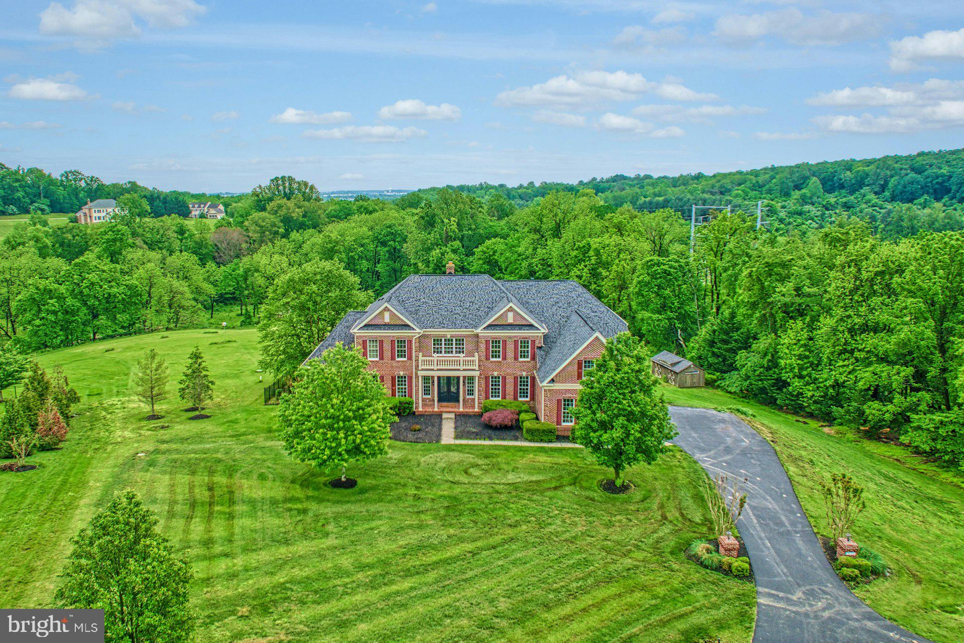 18102 Eaglesham Court Leesburg, VA 20175 - Photo 82 of 92 a front view of a house with garden