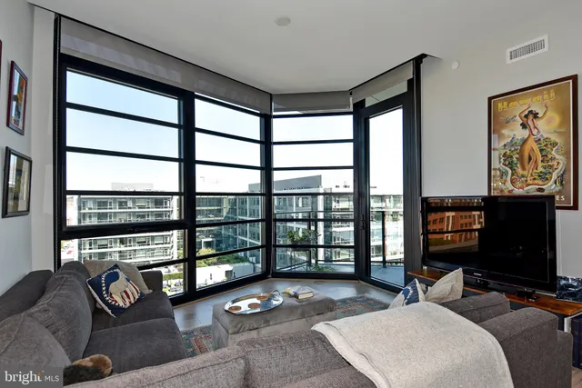 a bedroom with furniture and a flat screen tv