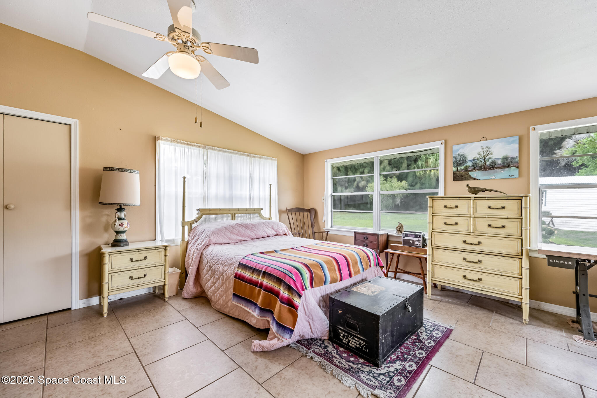 2030 City Acres Road Melbourne, FL 32904 - Photo 20 of 31 a bedroom with a bed and a window