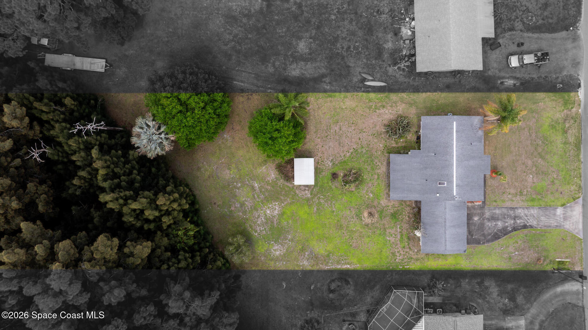2030 City Acres Road Melbourne, FL 32904 - Photo 21 of 31 an aerial view of a house with a yard