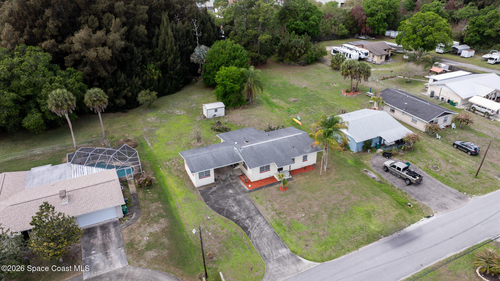 2030 City Acres Road Melbourne, FL 32904 - Photo 22 of 31 an aerial view of a house with yard swimming pool and outdoor seating