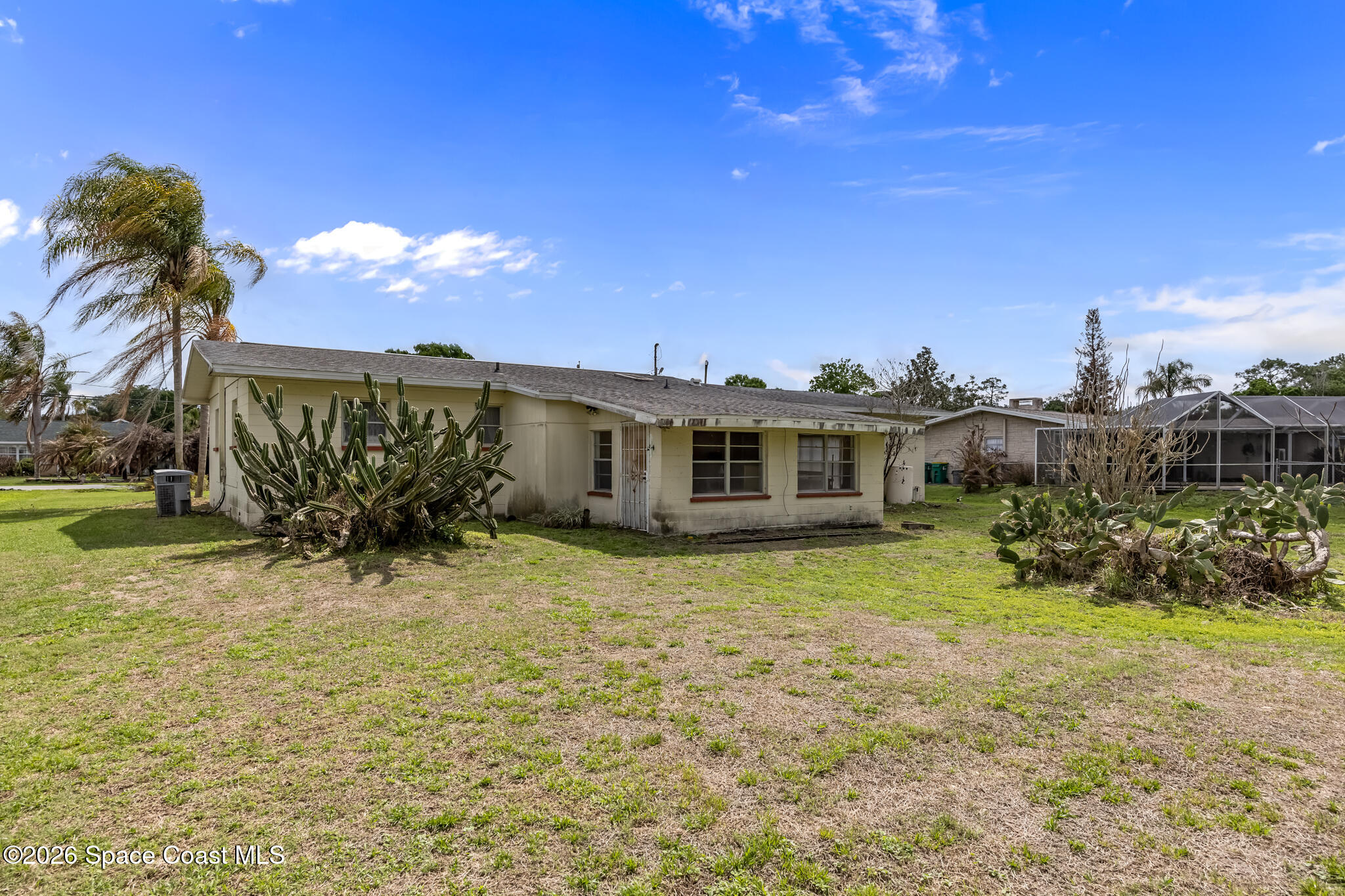 2030 City Acres Road Melbourne, FL 32904 - Photo 26 of 31 a front view of a house with a yard