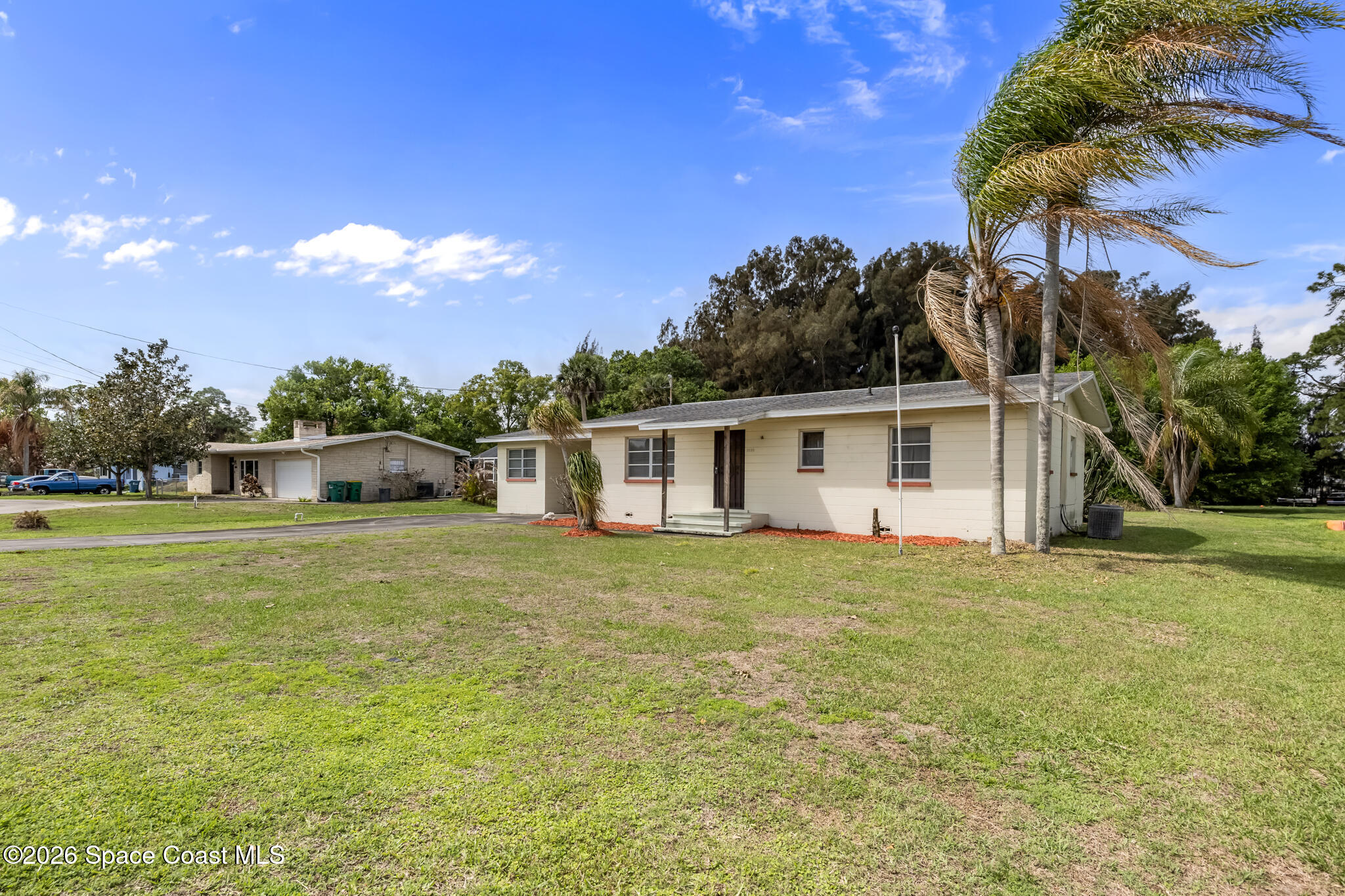 2030 City Acres Road Melbourne, FL 32904 - Photo 28 of 31 a front view of a house with a garden