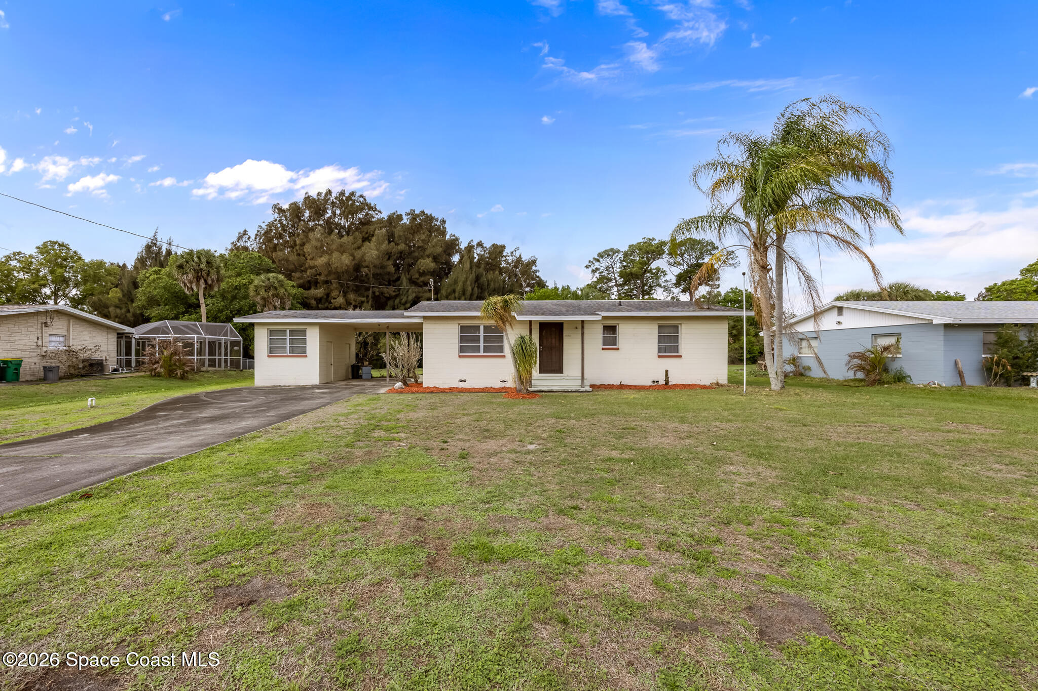 2030 City Acres Road Melbourne, FL 32904 - Photo 29 of 31 a front view of a house with garden