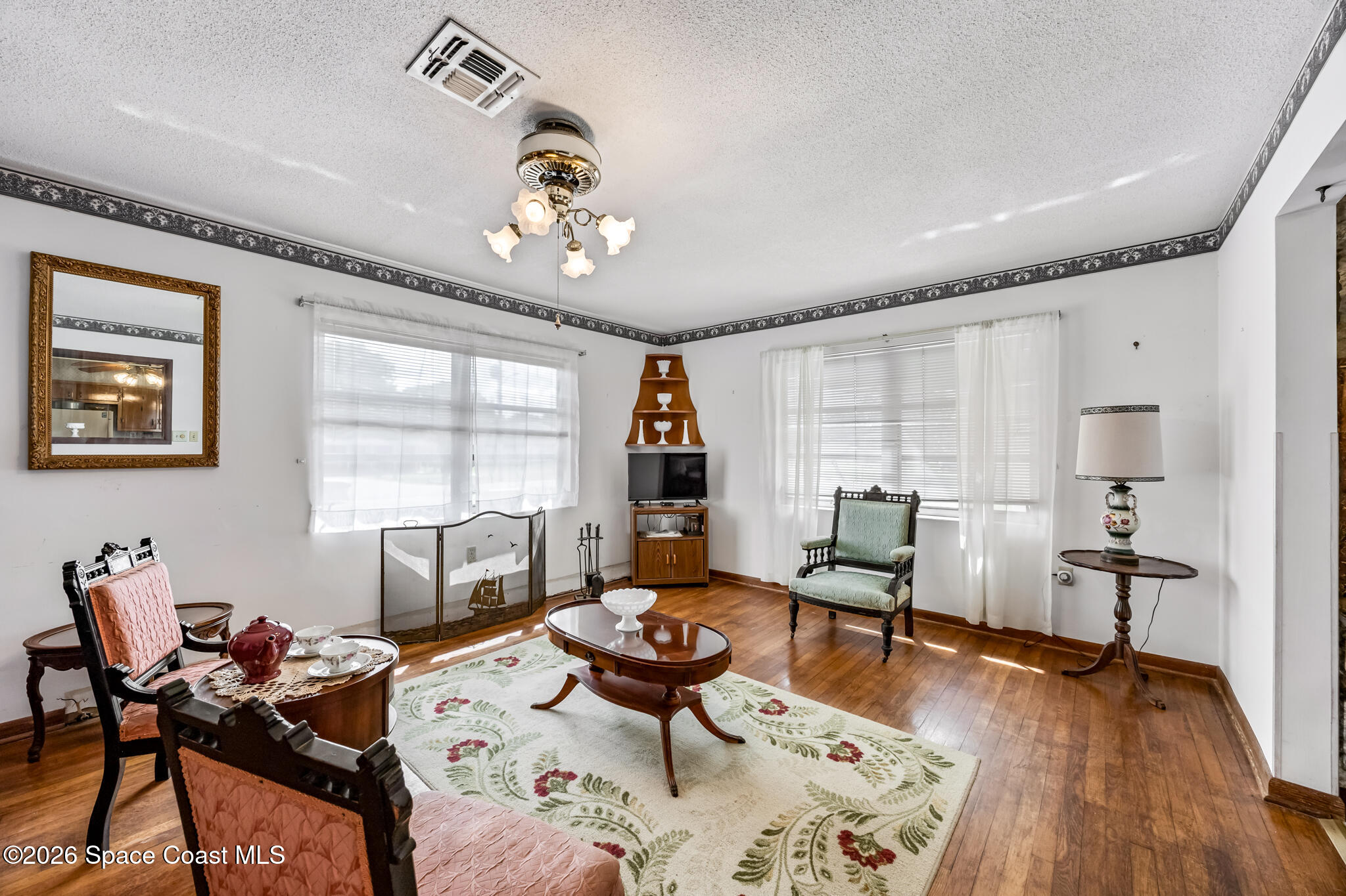 2030 City Acres Road Melbourne, FL 32904 - Photo 4 of 31 a living room with furniture and wooden floor