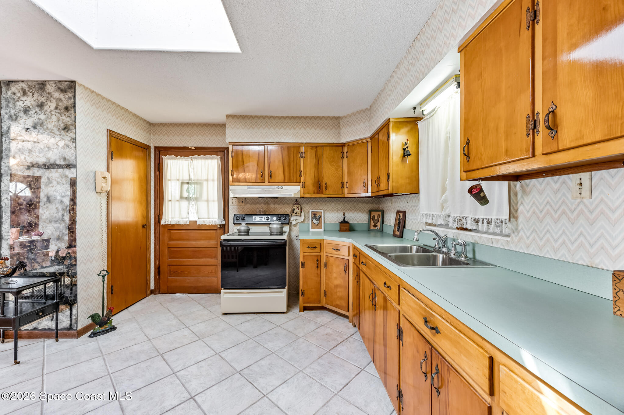 2030 City Acres Road Melbourne, FL 32904 - Photo 7 of 31 a kitchen with stainless steel appliances granite countertop a stove a sink and a refrigerator