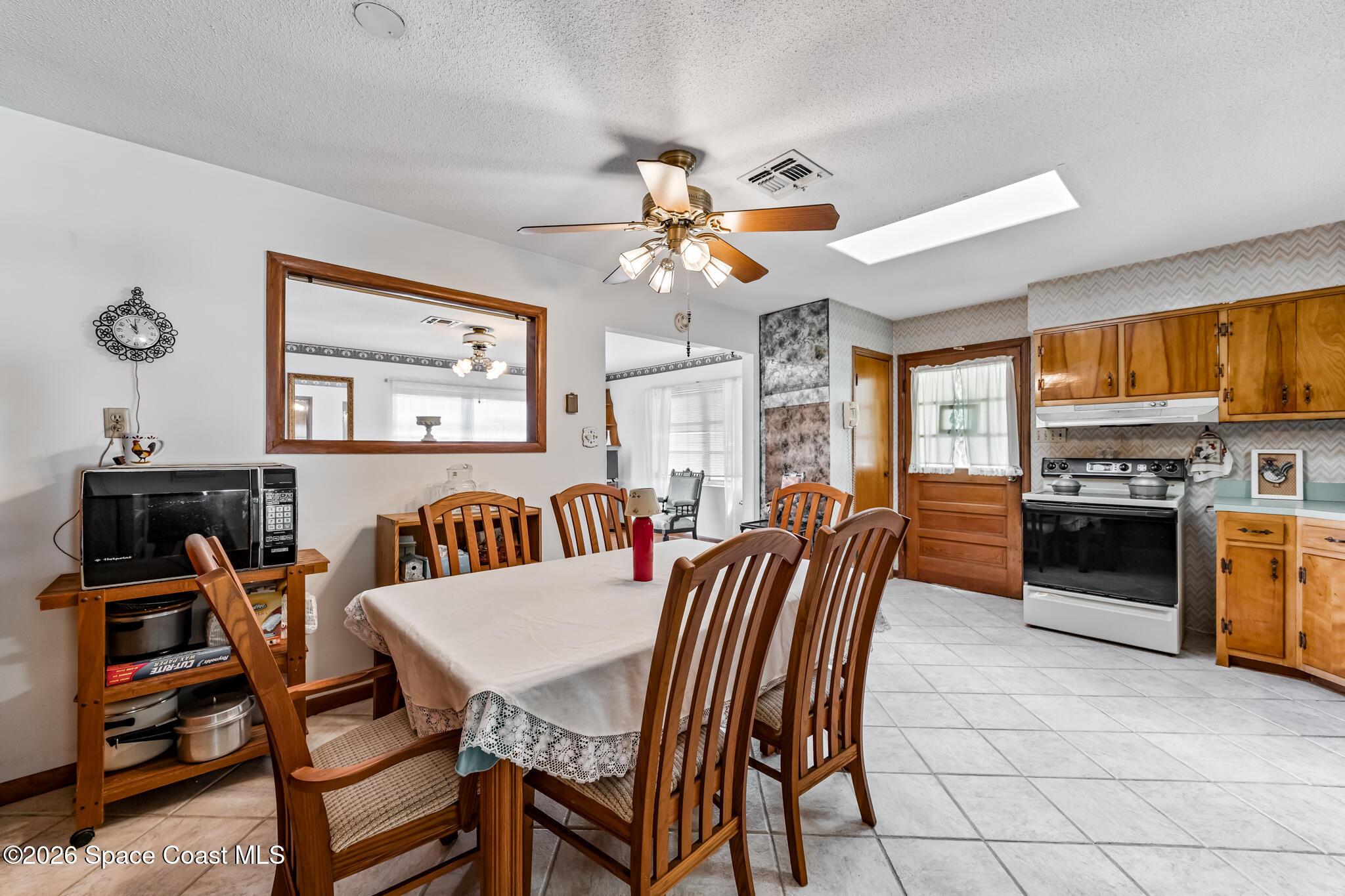 2030 City Acres Road Melbourne, FL 32904 - Photo 8 of 31 a dining room with furniture and window
