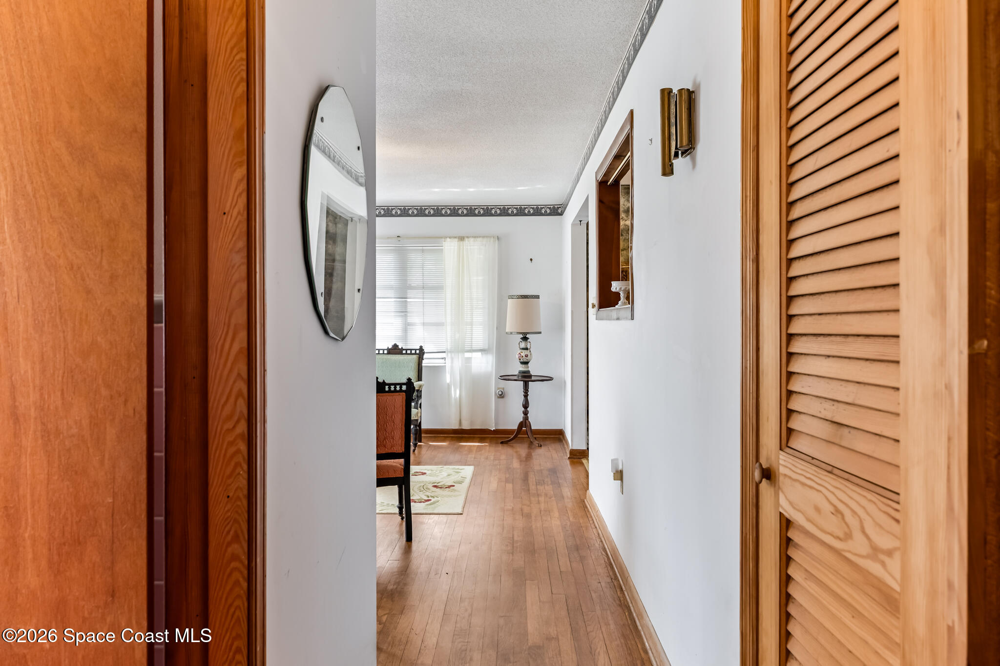 2030 City Acres Road Melbourne, FL 32904 - Photo 9 of 31 a view of a hallway with wooden floor and staircase