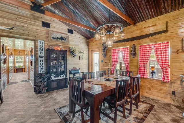 a view of a dining room with furniture window and outside view