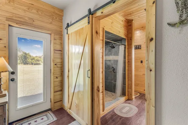 a view of a bathroom with a glass door