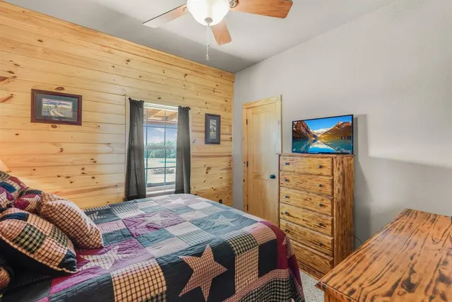 a bedroom with a bed and a dresser