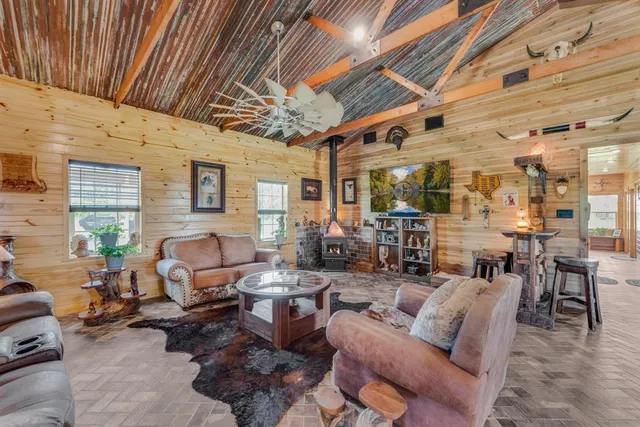 a living room with furniture and a chandelier