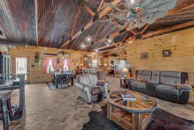 a living room with furniture and a clock