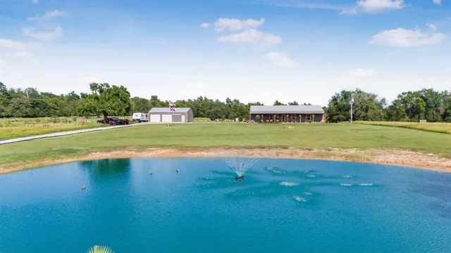 a view of a pool with a yard